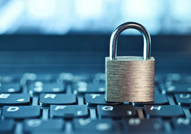 A padlock sitting on a keyboard