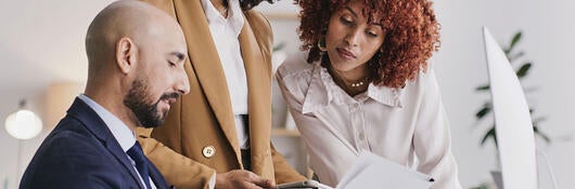 Three people working together