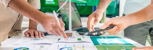 People look at chart spread on a table