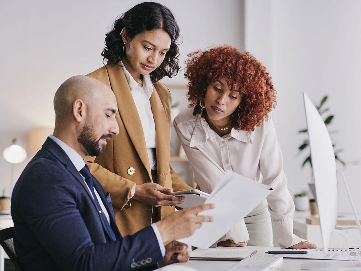 Three people working together