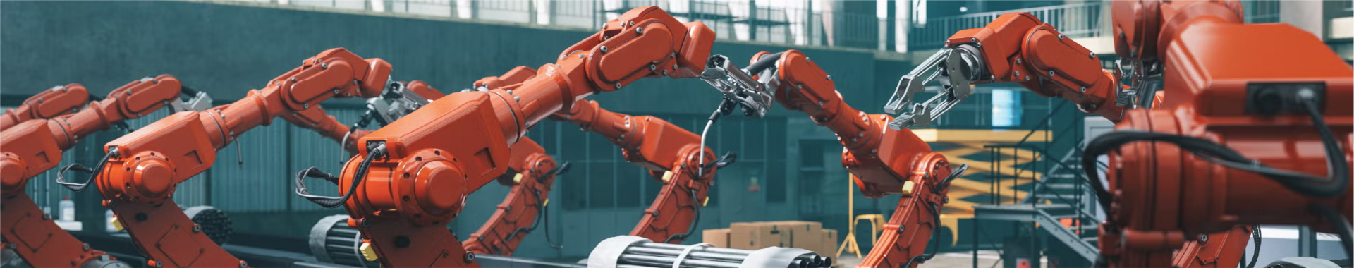 Robotic arms in a manufacturing plant