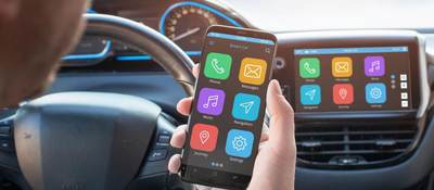 Person looking at car and phone interoperability
