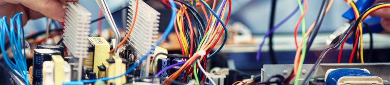 Electronics engineer repairs an audio/video device