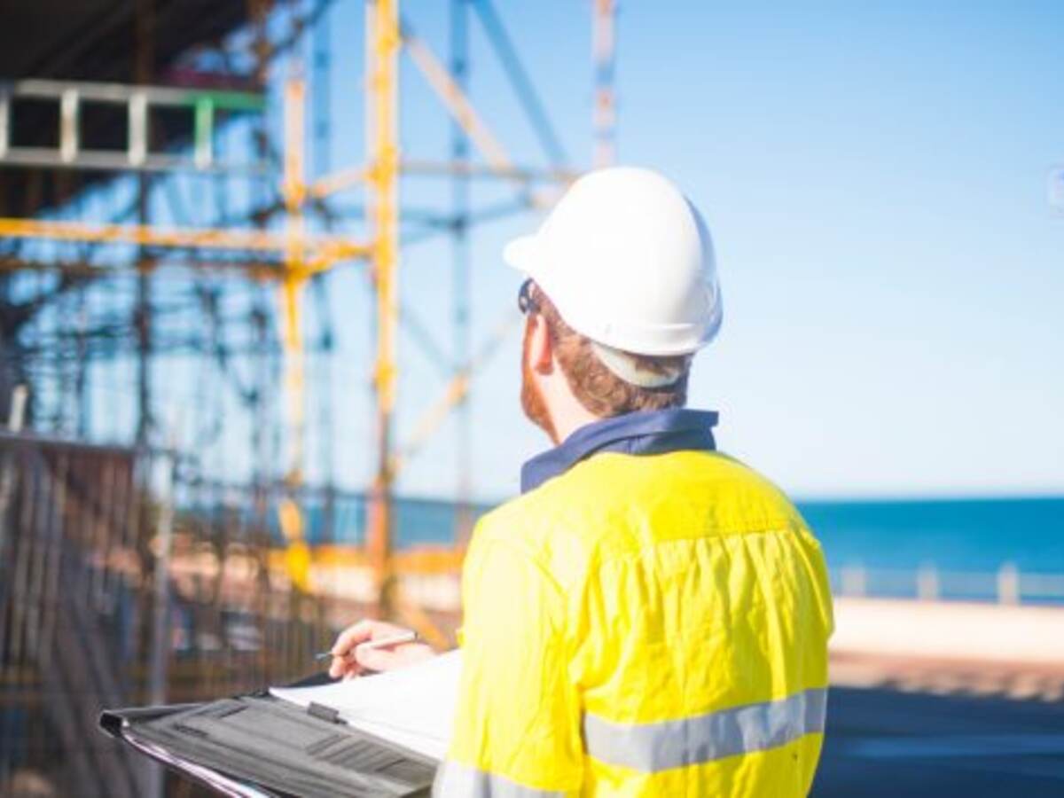 A person with a hard hat at a construction site